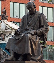 Seated bronze statue of James Watts in Manchester, by sculptor William Theed